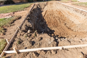 Zelf een zwembad aanleggen graven in de tuin